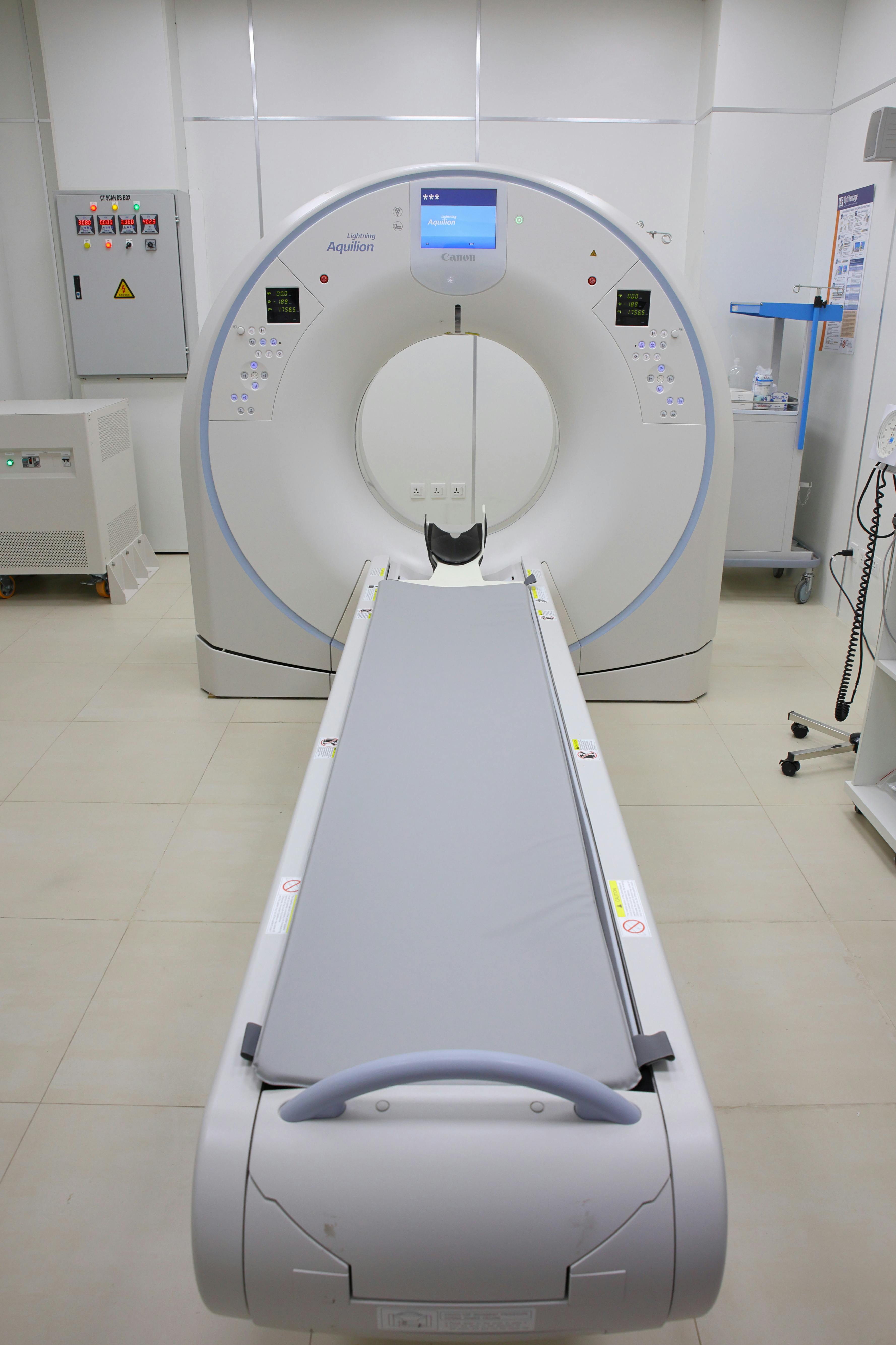 Modern CT scanner in a hospital room